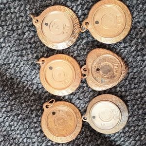 Vintage stamped pendant holds pictures with lenses  set of 6 as is .